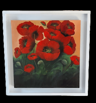 red poppies in white frame fluttering in the breeze