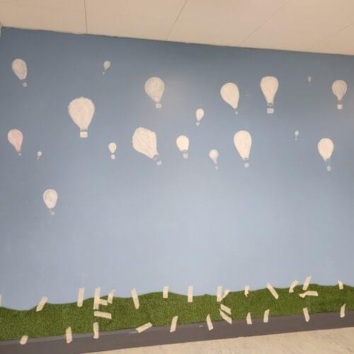 unleashing the spirit of hope and creativity with BLAST & Holy Spirit SNS with the creation of a mural of hot air balloons